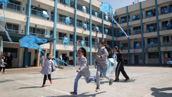 Girls support the Dignity Is Priceless campaign at an Unrwa school in Gaza City. (AFP/File Photo)