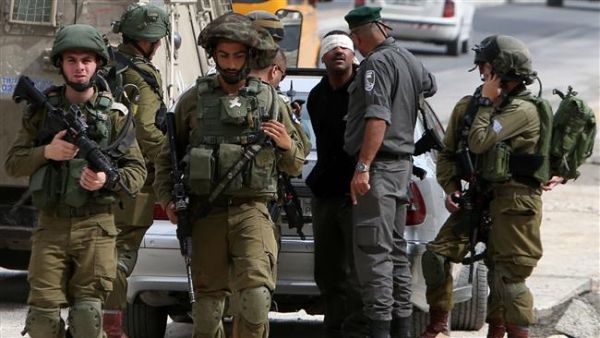 Israeli forces arrest a Palestinian in occupied West Bank. (AFP/ File Photo)