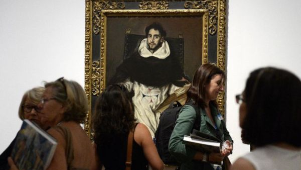 People look at the painting "Fray Hortensio Felix Paravicino" (1608-13) by El Greco during the presentation to the press of the exhibition dubbed the "El Greco and Modern Painting" at the Prado National museum in Madrid. (AFP/File)