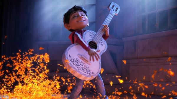 Coco plays the guitar. (Walt Disney)