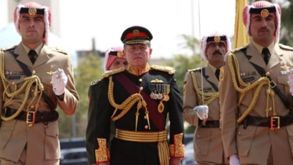 JORDAN, Amman : In a handout picture released by the Jordanian Royal Palace, Jordan&#039;s King Abdullah II marches with an honour guard to open the autumn session of the Jordanian parliament in the capital Amman on October 5, 2008