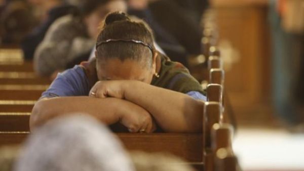 Egyptian Coptic Christians mourn during Sunday mass on January 2, 2011 at the Al-Qiddissine (The Saints) church in Alexandria which was targeted on New Year's Eve by a car bomb attack in which 21 people were killed.
