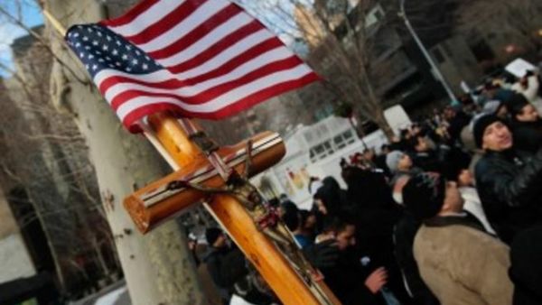 A cross is held by a supporter of Egypt's Coptic Christian community during a protest near the United Nations against the Egyptian government's treatment of its Christian minority December 14, 2010 in New York City