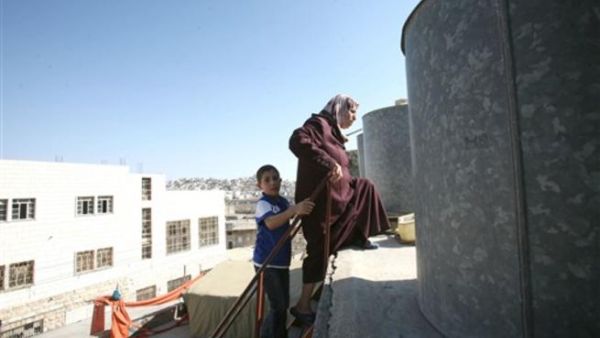Home-grown food projects like rooftop gardens, and raising rabbits and chickens on the roof help combat the severe poverty of Gaza's 80 percent food-aid dependent population