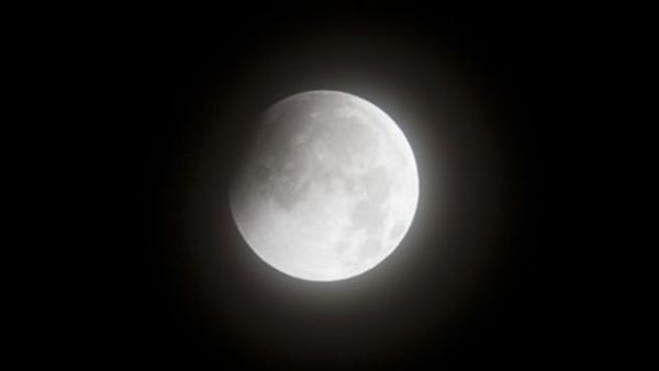 A picture taken in New York shows the moon in the early stages of a lunar eclipse on December 21, 2010. This eclipse is notable because it takes place just hours before the December solstice, which marks the beginning of northern winter and southern summer.