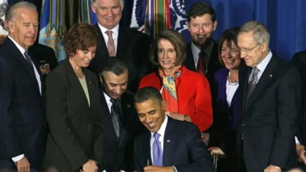 WASHINGTON, DC - DECEMBER 22: U.S. President Barack Obama (C) signs legislation repealing military policy law during a ceremony December 22, 2010 in Washington, DC. President Obama signed into law a bill repealing the "don't ask, don't tell" law against gays serving openly in the military