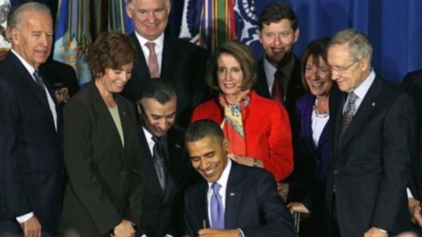 WASHINGTON, DC - DECEMBER 22: U.S. President Barack Obama (C) signs legislation repealing military policy law during a ceremony December 22, 2010 in Washington, DC. President Obama signed into law a bill repealing the "don't ask, don't tell" law against gays serving openly in the military