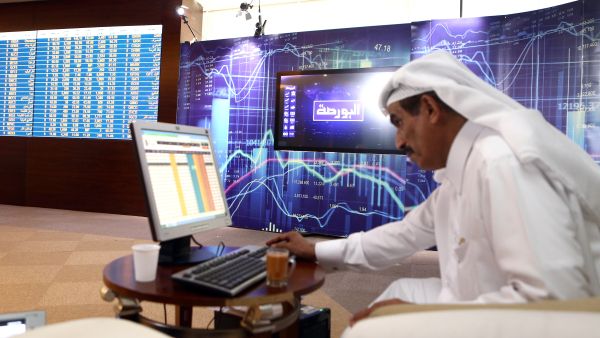 A Qatari trader prepares before the opening of the stock market at the Qatari stock exchange in Doha. (AFP) 