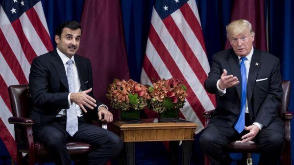 An awkward GIF has emerged from this excruciating meeting between US President Trump and Qatari Emir Sheikh Tamim bin Hamad Al Thani (AFP)