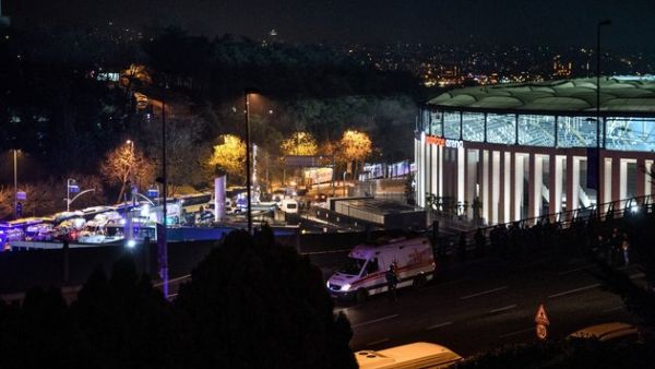 Turkish emergency workers, police officers and forensic work on the site where a car bomb exploded near the stadium of football club Besiktas in central Istanbul on December 10, 2016. (AFP/Getty/Ozan Kose)