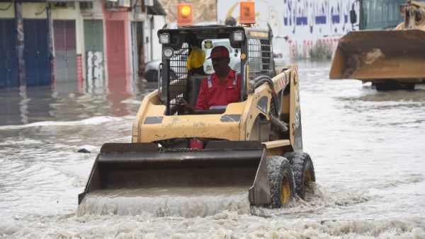 A Saudi worker clears a flooded street in Riyadh. (AFP/Fayez Nureldine) A Saudi worker clears a flooded street in Riyadh. (AFP/Fayez Nureldine)