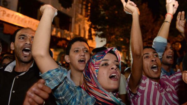  Protestors chant slogans during a demonstration on in Kenitra against the pardon by King Mohamed VI of Morocco of a Spanish pedophile (AFP/FADEL SENNA)