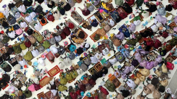 Muslim pilgrims arrive to perform the afternoon prayer in Mecca's Grand Mosque. (Image credit: AFP)