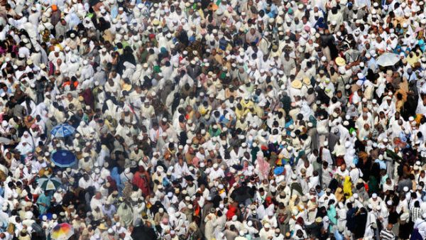 Muslim pilgrims leave after the afternoon prayer in Mecca's Grand Mosque. (Image credit: AFP)