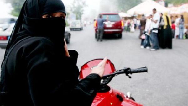 Saudi woman on motorcycle. [telegraph]