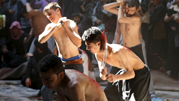 Afghan Shi'a hit themselves with chains during Ashura in Kabul (AFP/File)