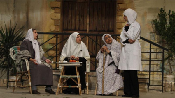Palestinian women perform in a play in Gaza city (AFP/File)