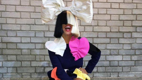 The Australian pop star belted out her hits in the shadow of her dancers. (Facebook)