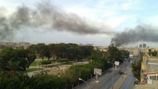 Smoke billows over residential neighbourhoods in Benghazi, following fierce clashes between the army and militants in the eastern Libyan city. (Image courtesy of Twitter/Wajid Saadi)