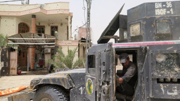 Iraqi counter-terrorism forces drive through a southern neighborhood in Fallujah. (AFP/Jean Marc Mojon)