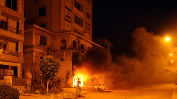 The armed men who ransacked the Muslim Brotherhood headquarters in Cairo on Monday had crossed a red line of violence, the ruling movement said, adding that it was considering action to defend itself.