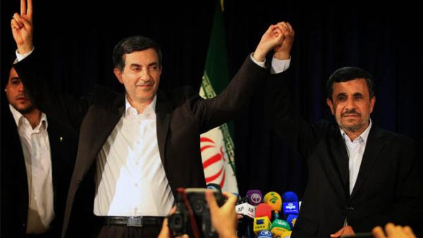 Iran President Mahmoud Ahmadinejad poses with close aide Esfandiar Rahim Mashaie after registering as a candidate in the presidential elections (AFP)