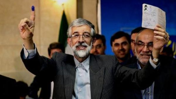 Conservative Iranian lawmaker Gholam Ali Haddad-Adel on Monday withdrew his candidacy from Iran's June 14 presidential election.