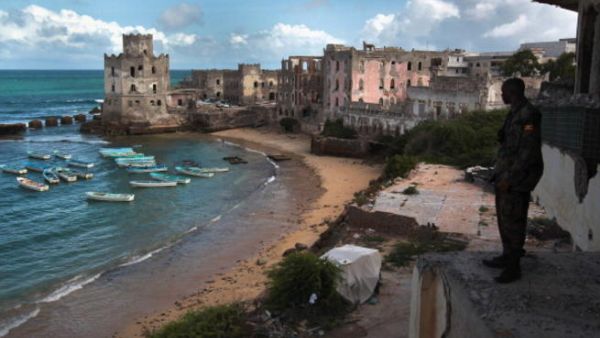 African Union soldier looks out over the Indian Ocean in Mogadishu (AFP)