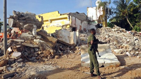 A Somali soldier stands guard on June 26, 2016 on the scene of the attack on a hotel in Mogadishu that killed 15 people the day before and was claimed by al-Shabaab militants. (AFP/Mohamed Abdiwahab) A Somali soldier stands guard on June 26, 2016 on the scene of the attack on a hotel in Mogadishu that killed 15 people the day before and was claimed by al-Shabaab militants. (AFP/Mohamed Abdiwahab)