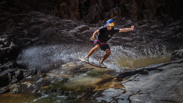 Wakeskating champion and Red Bull athlete Brian Grubb, battles the unforgiving water streams in a volcanic narrow valley In the Jordanian Desert.