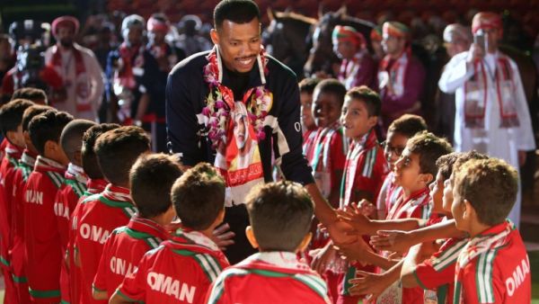 Omani goalkeeper Faiz al-Rushaidi walks among children during a celebration ceremony to welcome Oman's national football team after they won the 23th Gulf Cup of Nations, in Muscat on January 6, 2018.
MOHAMMED MAHJOUB / AFP