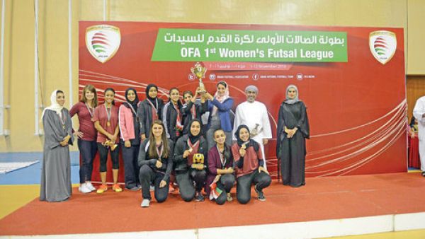 The victorious Al Ittifaq Club players receive the trophy from H H Mona bint Fahad al Said at the awards ceremony held at the Sultan Qaboos Sports Complex on Tuesday (Photo: Muscat Daily)