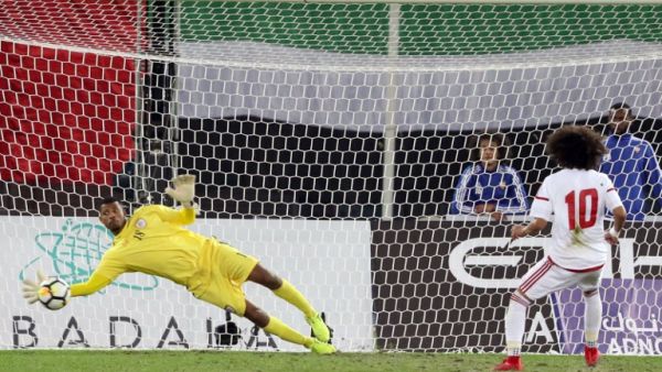 Oman's goalkeeper Fayez al-Rusheidi (L) stops the ball after a penalty by the UAE's player Omar Abdulrahman during the Gulf Cup of Nations 2017 final football match between Oman and the UAE at the Sheikh Jaber al-Ahmad Stadium in Kuwait City on January 5, 2018.
YASSER AL-ZAYYAT / AFP