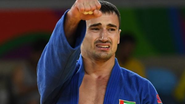United Arab Emirates's Sergiu Toma celebrates after defeating Italy's Matteo Marconcini during their men's -81kg judo contest bronze medal A match of the Rio 2016 Olympic Games in Rio de Janeiro on August 9, 2016.
Toshifumi KITAMURA / AFP