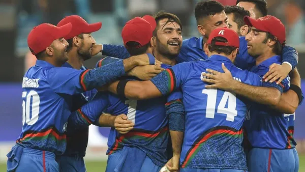 Afghan cricketer Rashid Khan (C), captain Asghar Afghan (R) celebrates with teammate after Match tied during the one day international (ODI) Asia Cup cricket match between Afghanistan and India at the Dubai International Cricket Stadium in Dubai on September 25, 2018.
ISHARA S. KODIKARA / AFP