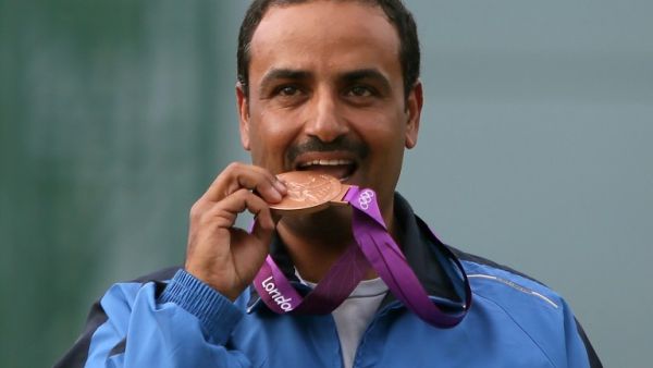 Kuwait's Fehaid al-Deehani, bronze medalist in the men's trap final at the London 2012 Olympic Games jubilatees at the podium at the Royal Artillery Barracks in London on August 6, 2012. AFP PHOTO/MARWAN NAAMANI
MARWAN NAAMANI / AFP