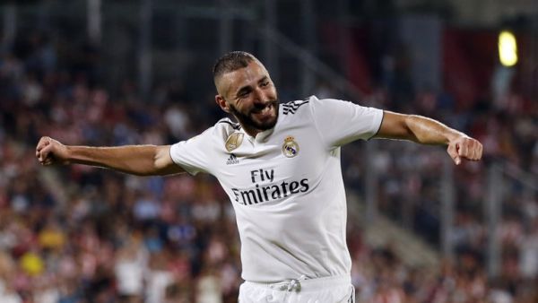 Real Madrid's French forward Karim Benzema celebrates his second goal during the Spanish league football match between Girona FC and Real Madrid CF at the Montilivi stadium in Girona on August 26, 2018.
Pau BARRENA CAPILLA / AFP Real Madrid's French forward Karim Benzema celebrates his second goal during the Spanish league football match between Girona FC and Real Madrid CF at the Montilivi stadium in Girona on August 26, 2018.
Pau BARRENA CAPILLA / AFP