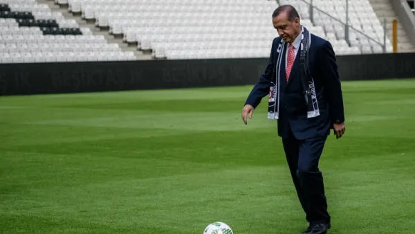 Turkish President Recep Tayyip Erdogan kicks the ball on April 10, 2016 in Istanbul at Besiktas football club's "Vodafone Arena" new stadium on its opening day.
OZAN KOSE / AFP