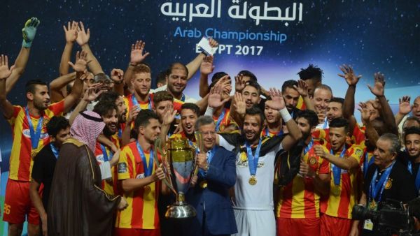 Tunis’s Esperence players hold up the trophy as they celebrate their victory over Jordan’s Al-Faisaly in the final match in Arab Club championship at Alexandria Stadium on August 6, 2017.
STR / AFP Tunis’s Esperence players hold up the trophy as they celebrate their victory over Jordan’s Al-Faisaly in the final match in Arab Club championship at Alexandria Stadium on August 6, 2017.
STR / AFP