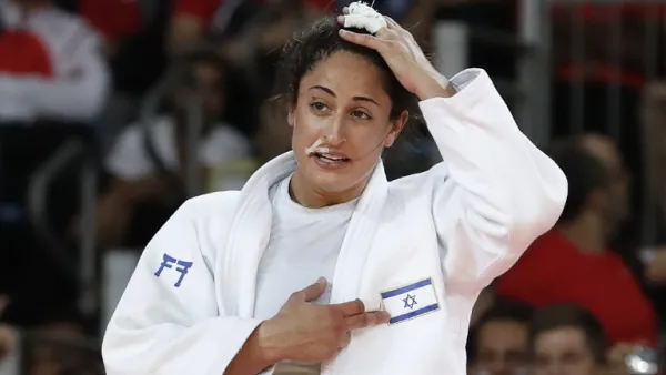 Israel's Yarden Gerbi celebrates after defeating Japan's Miku Tashiro during their women's -63kg judo contest bronze medal A match of the Rio 2016 Olympic Games in Rio de Janeiro on August 9, 2016.
Jack GUEZ / AFP