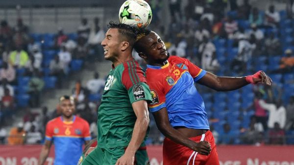 Democratic Republic of the Congo's midfielder Merveille Bokadi (R) heads the ball with Morocco's forward Aziz Bouhaddouz during the 2017 Africa Cup of Nations group C football match between DR Congo and Morocco in Oyem on January 16, 2017.
ISSOUF SANOGO / AFP