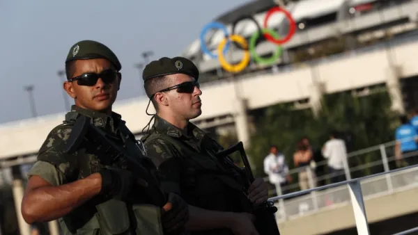 Brazilian security forces stand guard outside the Maracana stadium in Rio de Janeiro on August 5, 2016. A vast security blanket of 85,000 military personnel and police -- twice the number on duty at the 2012 London Games -- are draped over the city to ward off the threat of street crime and terror attacks.
Adrian DENNIS / AFP