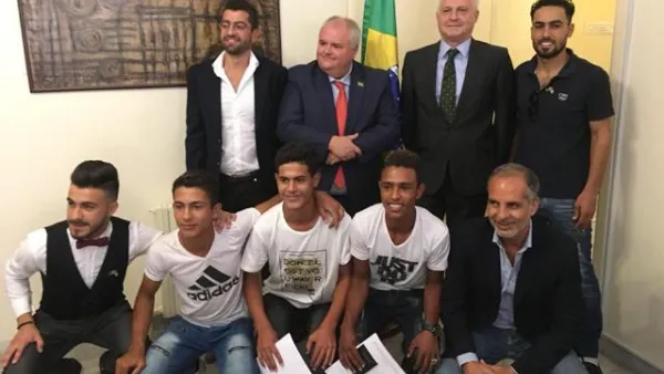 Brazilian Ambassador to Jordan Francisco Carlos Soares Luz pose for a group photo with young Syrian refugees at the embassy on Sunday (Photo: Camille Dupire)