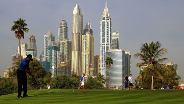 Tiger Woods of the United States follows his ball after playing a shot during the Dubai Desert Classic golf tournament at the Emirates Golf Club in Dubai on February 2, 2017.
NEZAR BALOUT / AFP