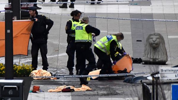 Emergency services work at the scene where a truck crashed into the Ahlens department store at Drottninggatan in central Stockholm, April 7, 2017. (AFP/Jonathan Nackstrand)