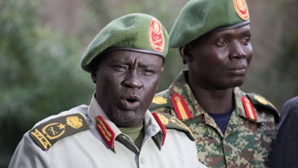Former Sudan People's Liberation Army (SPLA) chief of general training and former in-opposition general Dau Athorjang (L) speaks during a press conference, pledging his allegiance to the SPLA on July 10, 2016 in Juba. (AFP/Charles Atiki Lomodong) Former Sudan People's Liberation Army (SPLA) chief of general training and former in-opposition general Dau Athorjang (L) speaks during a press conference, pledging his allegiance to the SPLA on July 10, 2016 in Juba. (AFP/Charles Atiki Lomodong)