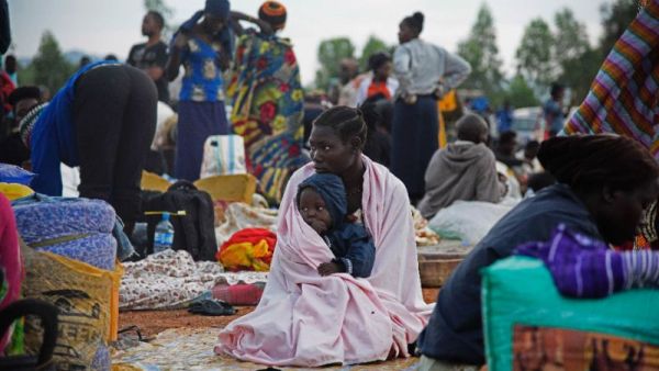 A woman and child pictured at a make-shift camp in the Amuru District of Uganda, which borders war-torn South Sudan, on July 16, 2016. (AFP/Isaac Kasamani)