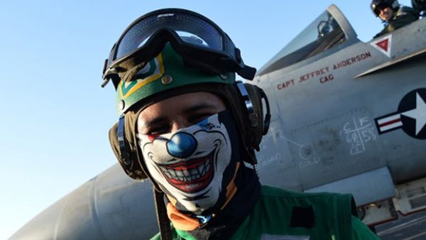 A sailor stands near an An F/A-18E Super Hornet on the US navy's super carrier USS Dwight D. Eisenhower in the Mediterranean Sea. Air Wings embarked aboard conducted strikes against the terrorist group ISIL in Libya, Iraq and Syria. (AFP/File)