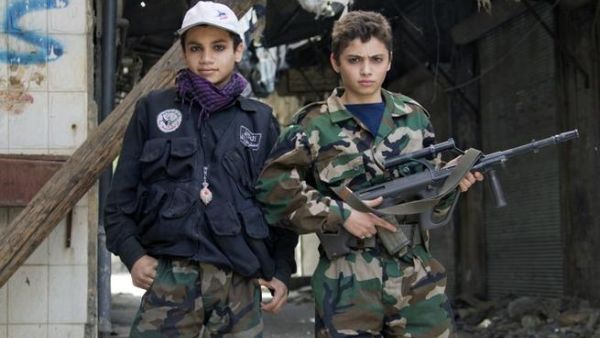 Free Syrian army's young fighters pose on April 2 (Guillaume Briquet/ AFP)