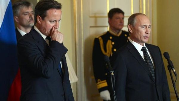 British Prime Minister David Cameron  and Russian President Vladimir Putin in London on Sunday, where they discussed the latest developments in Syria.(AFP PHOTO/POOL/ANTHONY DEVLIN)